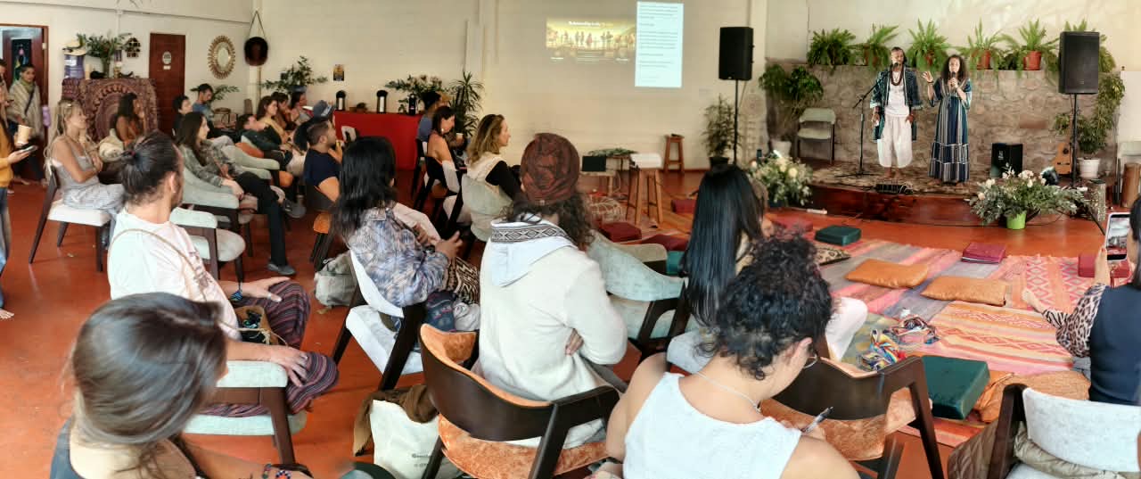 A group seated together during a workshop led by two facilitators